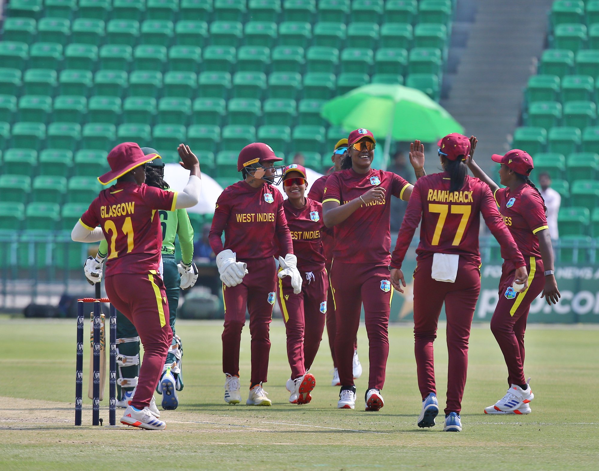 West Indies players celebrate the wicket of Gull Feroza a